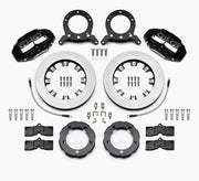 Wilwood black D8-4 kit laid out with plain-face rotor rings, separate hats, brake pads, brackets, braided hoses and hardware
