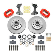 Wilwood red Dynalite front kit laid out with plain hub-and-rotor units, bearings, seals, pads and brackets
