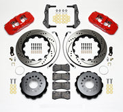 Wilwood red AERO4 kit laid out with drilled-and-slotted rotor rings, separate hats, brake pads, brackets, braided hoses and hardware