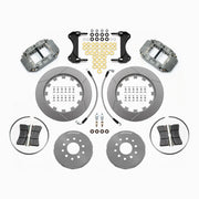 Wilwood gray Forged Superlite 4R kit laid out with slotted rotor rings, separate hats, brake pads, brackets, braided hoses and hardware