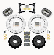 Wilwood gray Dynapro radial kit laid out with slotted rotor rings, separate hats, brake pads, brackets and hardware
