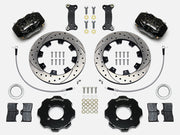 Wilwood black Dynalite kit laid out with drilled-and-slotted rotor rings, separate hats, brake pads, brackets, braided hoses and hardware