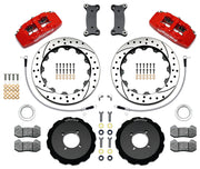 Wilwood red Dynapro 6 kit laid out with drilled-and-slotted rotor rings, separate hats, brake pads, brackets, braided hoses and hardware