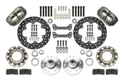 Wilwood Dynapro brake kit: Two gray anodized Dynapro calipers, thin drilled rotors, round rotor adapters, aluminum hubs, bearings, pads, spindle brackets and fasteners arranged as a parts layout; 10.75-inch front brake setup for 1982–1992 Camaro/Firebird.
