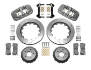 Wilwood AERO6-ST brake kit: Two gray anodized calipers, slotted rotor rings, separate dark dynamic hats, pads, brackets and fasteners; no hoses are visible; 14-inch front brake setup for Mustang/RideTech Hub.