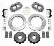 Wilwood Superlite 4R-ST brake kit: Two gray anodized calipers, slotted rotor rings, separate dark dynamic hats, pads, brackets and fasteners; no hoses are visible; 14-inch rear brake setup for 2015–2023 Mustang.