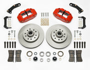 Wilwood Superlite 6R brake kit: Two red calipers, plain integral rotor/hub castings, pads, bearings, brackets and mounting fasteners arranged on white; 11.86-inch front brake setup for 1960–1963 Chevy/GMC 2WD.