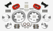 Wilwood Dynalite brake kit: Two red calipers, plain rotor rings, separate aluminum adapters and hubs, bearings, pads, spindle brackets and fasteners arranged as a kit layout; 12.19-inch front brake setup for Mustang II/Pinto/Bobcat.