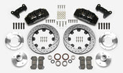 Wilwood Dynapro 6 brake kit: Two black calipers, drilled-and-slotted rotor rings, separate aluminum adapters and hubs, bearings, pads, spindle brackets and fasteners arranged as a kit layout; 12.19-inch front brake setup for Pinto/Bobcat/Mustang II.