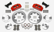 Wilwood Dynapro 6 brake kit: Two red calipers, plain rotor rings, separate aluminum adapters and hubs, bearings, pads, spindle brackets and fasteners arranged as a kit layout; 12.19-inch front brake setup for Pinto/Bobcat/Mustang II.
