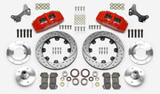 Wilwood Dynapro 6 brake kit: Two red calipers, drilled-and-slotted rotor rings, separate aluminum adapters and hubs, bearings, pads, spindle brackets and fasteners arranged as a kit layout; 12.19-inch front brake setup for ProSpindle 5 x 5.