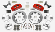 Wilwood Dynapro 6 brake kit: Two red calipers, plain rotor rings, separate aluminum adapters and hubs, bearings, pads, spindle brackets and fasteners arranged as a kit layout; 12.19-inch front brake setup for ProSpindle 5 x 5.