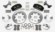 Wilwood Dynapro 6 brake kit: Two black calipers, plain rotor rings, separate aluminum adapters and hubs, bearings, pads, spindle brackets and fasteners arranged as a kit layout; 12.19-inch front brake setup for ProSpindle 5 x 5.