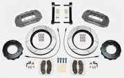 Wilwood TX6R brake kit: Two gray anodized TX6R calipers, slotted rotor rings, separate dark eight-hole hats, pads, hoses, fittings, brackets and fasteners in a kit layout; 15-inch front brake setup for F-250/F-350 4WD SRW.