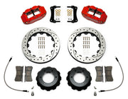 Wilwood Superlite 6R brake kit: Two red Superlite calipers, drilled-and-slotted rotors, separate deep black hats, pads, curved braided hoses, fittings, brackets and fasteners laid out; 12.88-inch front brake setup for Toyota/Lexus Six-Lug.
