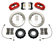 Wilwood Superlite 6R brake kit: Two red Superlite calipers, slotted rotors, separate deep black hats, pads, curved braided hoses, fittings, brackets and fasteners laid out; 12.88-inch front brake setup for Toyota/Lexus Six-Lug.