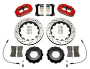Wilwood Superlite 6R brake kit: Two red Superlite calipers, drilled-and-slotted rotors, separate deep black hats, pads, curved braided hoses, fittings, brackets and fasteners laid out; 14-inch front brake setup for Toyota/Lexus Six-Lug.