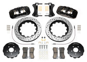 Wilwood AERO6 brake kit: Pair of black AERO6 calipers, drilled-and-slotted rotor rings, separate black hats, pads, braided hoses, fittings, brackets and fasteners in a flat parts layout; 15-inch front brake setup for Audi A4/A5/S4/S5.