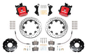 Wilwood CPB brake kit: Two red combination parking-brake calipers with visible actuating mechanisms, drilled-and-slotted rotors, separate hats, pads, hoses, brackets and fasteners; 12.19-inch rear brake setup for Audi A4/S4/RS4/S5.