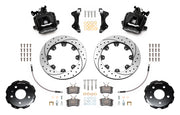 Wilwood CPB brake kit: Two black combination parking-brake calipers with visible actuating mechanisms, drilled-and-slotted rotors, separate hats, pads, hoses, brackets and fasteners; 12.19-inch rear brake setup for Audi A4/S4/RS4/S5.
