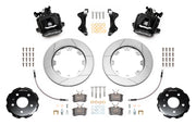 Wilwood CPB brake kit: Two black combination parking-brake calipers with visible actuating mechanisms, slotted rotors, separate hats, pads, hoses, brackets and fasteners; 12.19-inch rear brake setup for Audi A4/S4/RS4/S5.