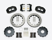 Wilwood Superlite 6R brake kit: Two black calipers, drilled-and-slotted rotor rings, separate dark hats, pads, brackets, centering rings and fasteners laid out; no hoses visible; 12.88-inch front brake setup for Ford Panther Cars.
