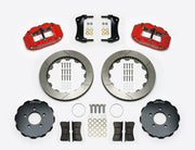 Wilwood Superlite 6R brake kit: Two red calipers, slotted rotor rings, separate dark hats, pads, brackets, centering rings and fasteners laid out; no hoses visible; 12.88-inch front brake setup for Ford Panther Cars.