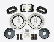 Wilwood Superlite 6R brake kit: Two black calipers, drilled-and-slotted rotor rings, separate dark hats, pads, brackets, centering rings and fasteners laid out; no hoses visible; 14-inch front brake setup for Ford Panther Cars.