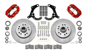 Wilwood Dynalite-M brake kit: Two red Dynalite calipers, plain integral rotor/hub castings, pads, bearings, spindle brackets and fasteners laid out; 11.5-inch front brake setup for 1965–1968 Chevy Full-Size.