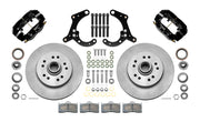 Wilwood Dynalite-M brake kit: Two black Dynalite calipers, plain integral rotor/hub castings, pads, bearings, spindle brackets and fasteners laid out; 11.5-inch front brake setup for 1965–1968 Chevy Full-Size.