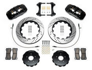 Wilwood AERO6 brake kit: Pair of black AERO6 calipers, drilled-and-slotted rotors, separate dark hats, pads, braided hoses, brackets and fasteners arranged as a parts layout; 14-inch front brake setup for 370Z/G35/G37.