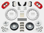Wilwood Superlite 6R brake kit: Two red calipers, slotted rotor rings, deep dark hats, separate aluminum hubs, bearings, pads, mounting brackets, wheel studs and fasteners in a layout; 12.88-inch front brake setup for 1957–1967 F-100.