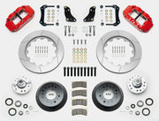 Wilwood Superlite 6R brake kit: Two red calipers, slotted rotor rings, deep dark hats, separate aluminum hubs, bearings, pads, mounting brackets, wheel studs and fasteners in a layout; 14-inch front brake setup for 1957–1967 F-100.
