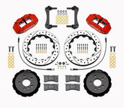 Wilwood five-lug Mini front kit layout with red Superlite 6R calipers, 12.88-inch drilled-and-slotted rotors, aluminum hats, pads and mounting brackets