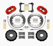 Wilwood five-lug Mini front kit layout with red Superlite 6R calipers, 12.88-inch GT-slotted rotors, aluminum hats, pads and mounting brackets
