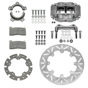Wilwood sprint rear kit laid out with a gray four-piston caliper, thin solid titanium slotted rotor, splined axle clamp, adapter, pads and bracket