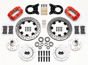 Wilwood red 1970–1974 Ford/Mercury spindle kit laid out with drilled-and-slotted rotor rings, aluminum hubs, rotor adapters, bearings, seals, pads and brackets