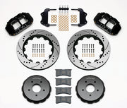 Wilwood black Pontiac GTO front kit laid out with drilled-and-slotted rotor rings, separate hats, calipers, pads and mounting brackets