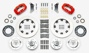 Wilwood red early A-body 12.19-inch front kit laid out with plain-face rotor rings, aluminum hubs, rotor adapters, bearings, seals, pads and brackets