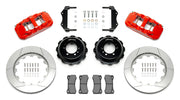 Wilwood red Superformance GT40 rear kit laid out with slotted rotor rings, separate hats, calipers, pads and mounting brackets