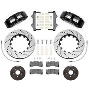 Wilwood SX6R front brake kit, Corvette C7, 15-inch SRP rotors: Parts layout with two black SX6R calipers, drilled & slotted rotor rings, separate black hats, pads, brackets and fasteners.