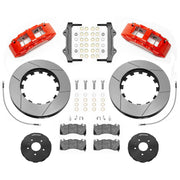 Wilwood SX6R front brake kit, Corvette C7, 15-inch GT rotors: Parts layout with two red SX6R calipers, gt slotted rotor rings, separate black hats, pads, brackets and fasteners.