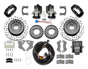 Wilwood Dynalite rear brake kit, Big Ford new-style 2.50-inch offset, 12.19-inch SRP rotors: Parts layout with two black service calipers, two motor-driven parking calipers, drilled & slotted rotor assemblies, mounting plates, pads, coiled harness, controller and fasteners.