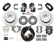 Wilwood Dynalite rear brake kit, Big Ford new-style 2.50-inch offset, 12.19-inch plain rotors: Parts layout with two black service calipers, two motor-driven parking calipers, plain face rotor assemblies, mounting plates, pads, coiled harness, controller and fasteners.