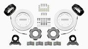 Wilwood Dynalite front brake kit, TR4A / TR250 / TR6, 11-inch plain rotors: Parts layout with two black Dynalite calipers, plain face rotor rings, separate black hats, pads, brackets and fasteners, with curved flexlines visible.
