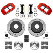 Wilwood Superlite 6R front brake kit, five-lug GM truck/SUV iron ProSpindles, 12.19-inch SRP rotors: Parts layout with two red Superlite 6R calipers, drilled & slotted rotors, separate hubs, black rotor hats, pads, bearings and mounting hardware.