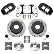 Wilwood Superlite 6R front brake kit, five-lug GM truck/SUV iron ProSpindles, 12.19-inch SRP rotors: Parts layout with two black Superlite 6R calipers, drilled & slotted rotors, separate hubs, black rotor hats, pads, bearings and mounting hardware.