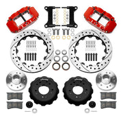 Wilwood Superlite 6R front brake kit, five-lug GM truck/SUV iron ProSpindles, 13.06-inch SRP rotors: Parts layout with two red Superlite 6R calipers, drilled & slotted rotors, separate hubs, black rotor hats, pads, bearings and mounting hardware.