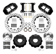 Wilwood Superlite 6R front brake kit, five-lug GM truck/SUV iron ProSpindles, 13.06-inch SRP rotors: Parts layout with two black Superlite 6R calipers, drilled & slotted rotors, separate hubs, black rotor hats, pads, bearings and mounting hardware.