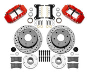Wilwood Superlite 6R front brake kit, six-lug GM truck/SUV iron ProSpindles, 12.19-inch SRP rotors: Parts layout with two red Superlite 6R calipers, drilled & slotted rotors, separate hubs, black rotor hats, pads, bearings and mounting hardware.